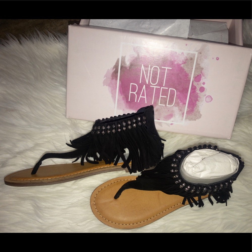 Black leather fringe sandals.